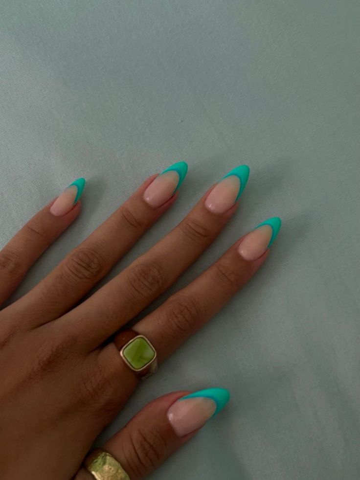 Chic Almond-Shaped Nails with Vibrant Turquoise Tips on Soft Nude Base