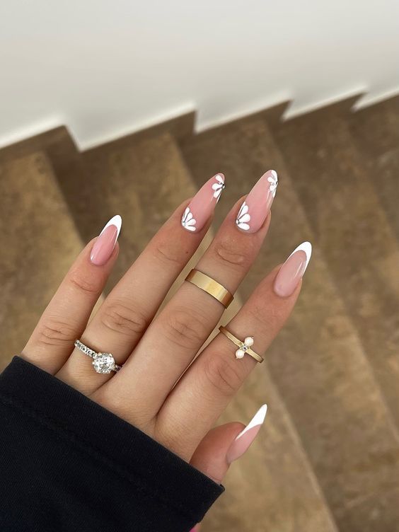 Chic Elegant Nail Design: Almond Shapes with Soft Pink Base and Whimsical Butterfly Accents