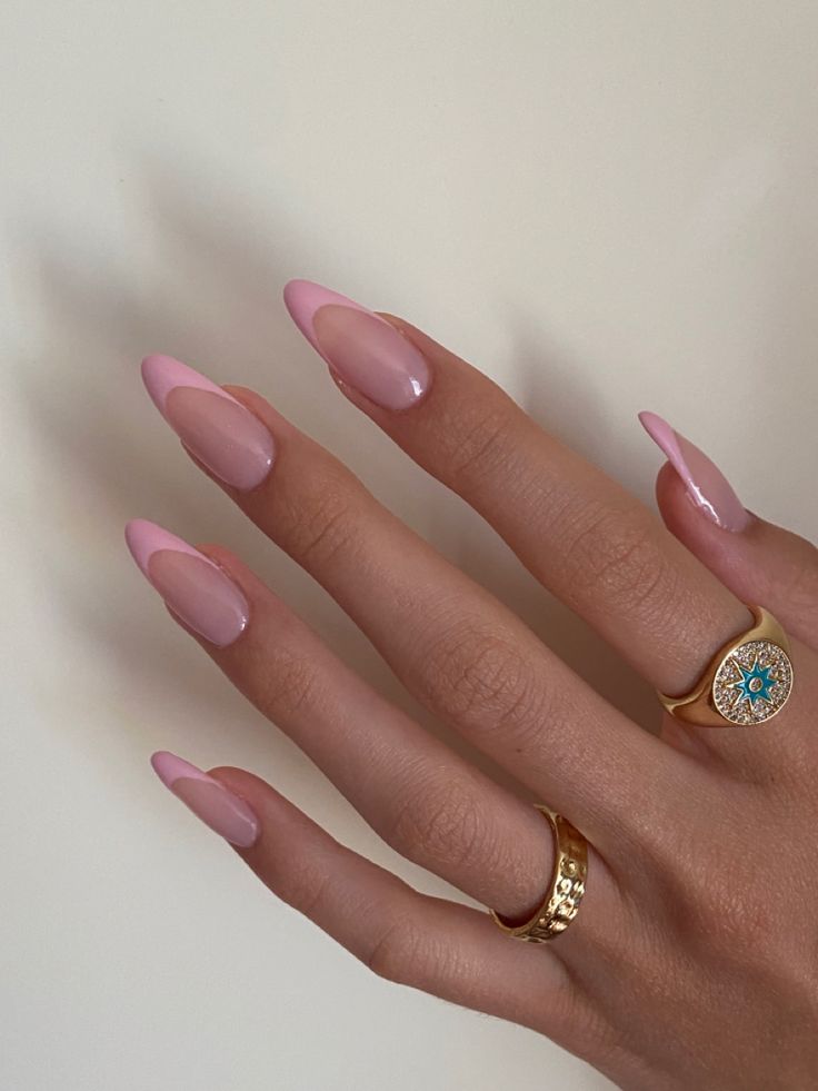 Chic Soft Pink French Tip Almond Nails: A Blend of Modern Elegance and Timeless Beauty.