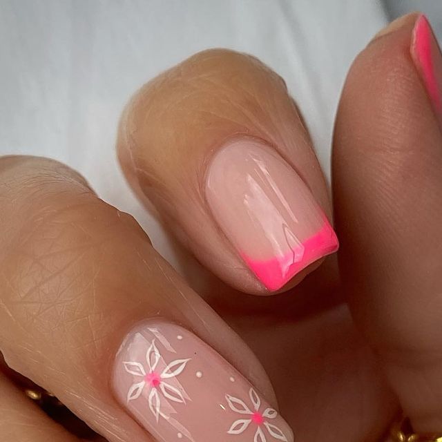 Elegant Nude and Pink Nail Design with Floral Accents for Versatile Occasions.