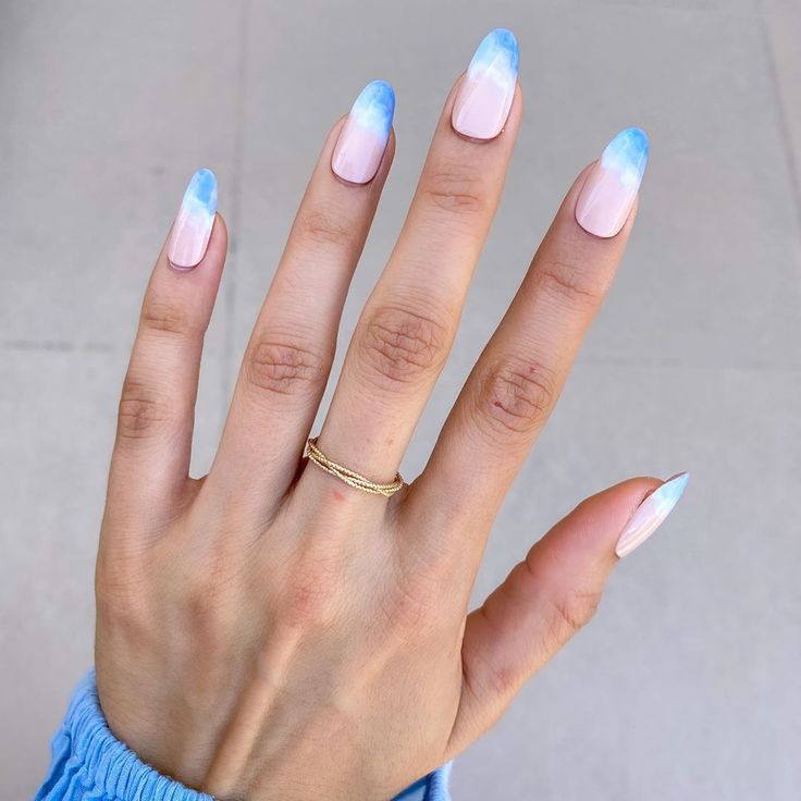 Chic Pastel Ombre Nail Design: A Dreamy Blend of Pink and Blue in Elongated Shape.