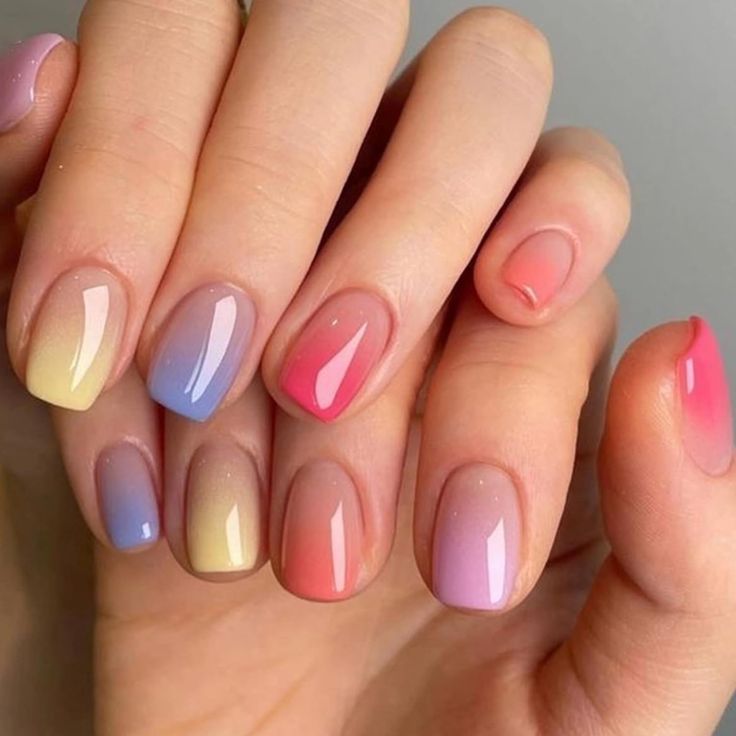 Pastel Ombre Nail Art: A Cheerful Blend of Lavender, Coral, and Pink.