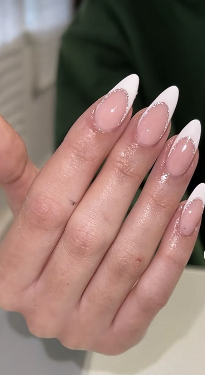 Sophisticated Almond-Shaped French Tip Nail Design with Sheer Pink and Glossy Accents.