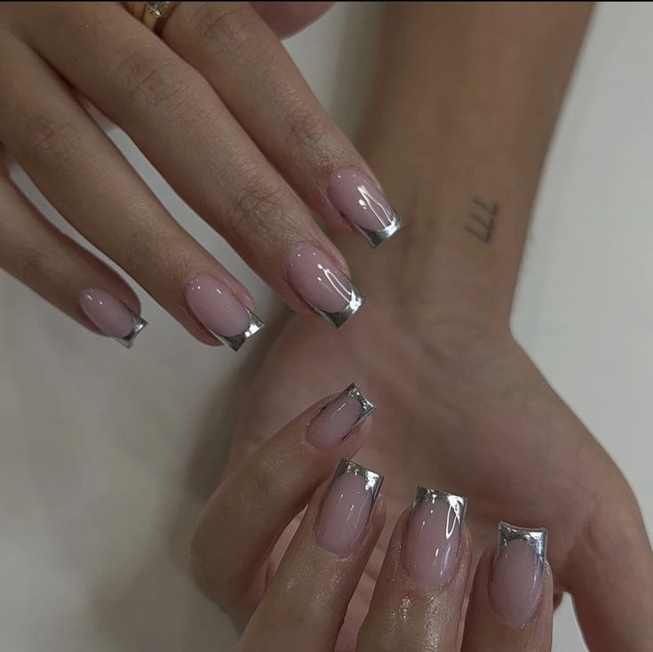 Chic Soft Pink Nails with Metallic Silver Tips: A Modern and Glamorous Design.