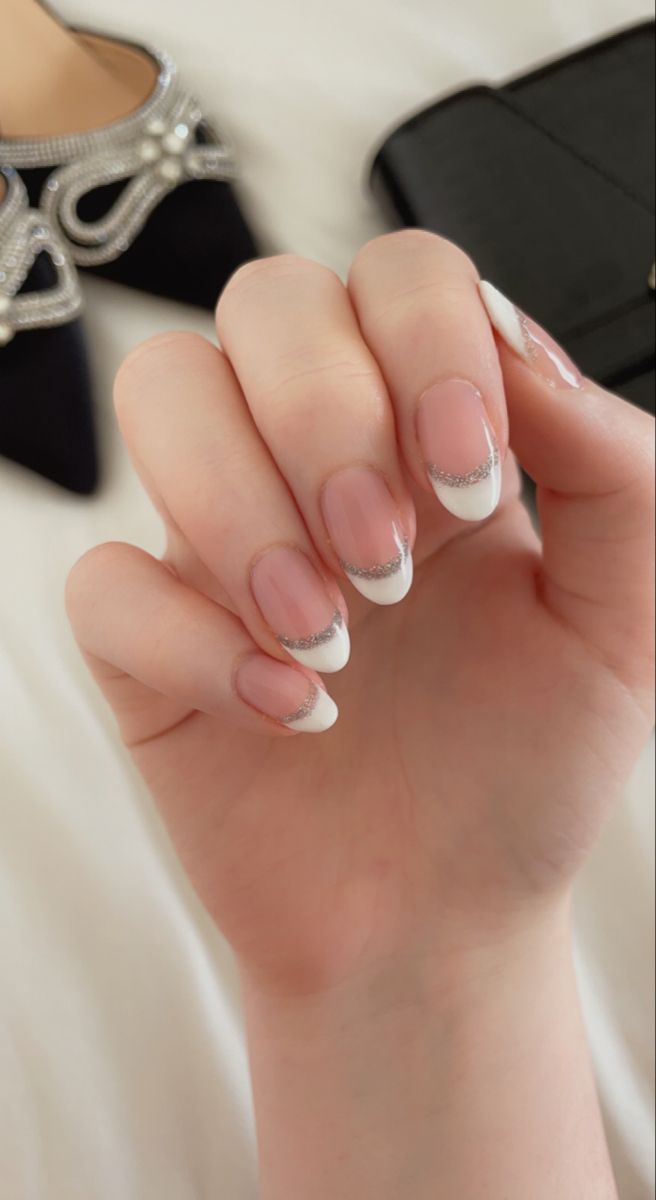 Sophisticated French Tip Nail Design with Subtle Silver Accents for Formal Elegance.