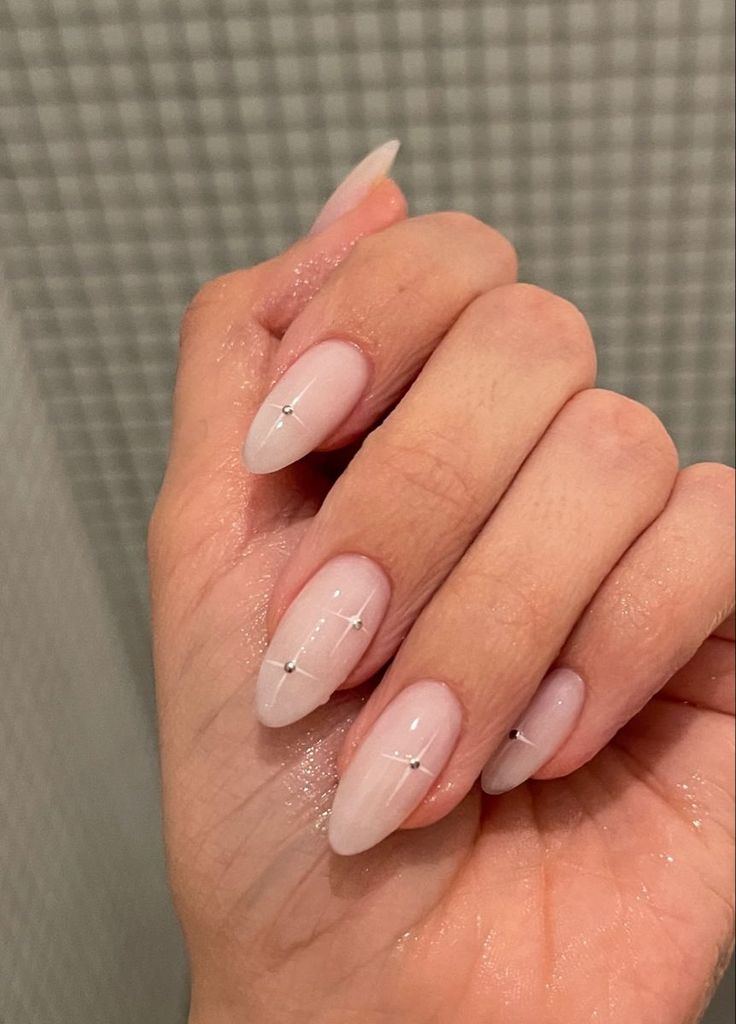 Sophisticated Almond-Shaped Nails with Soft Pink Gradient and Silver Accents