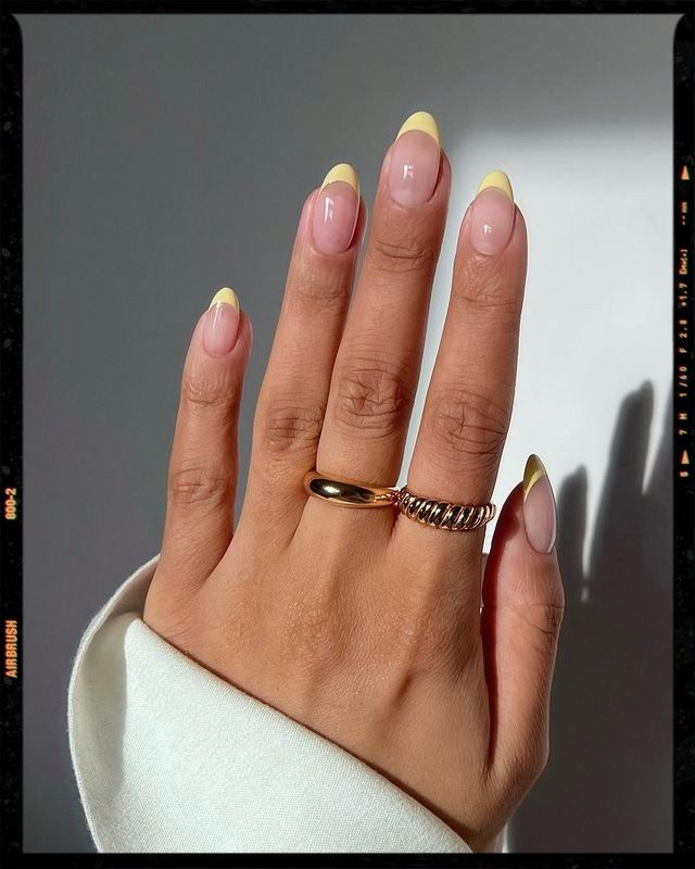 Chic and Cheerful: Colorful French Tips with Sophisticated Minimalist Accents.