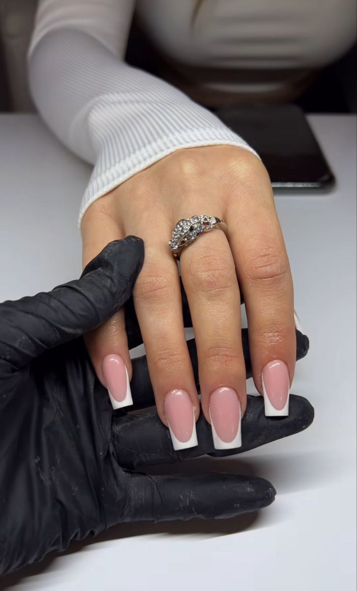 Sophisticated Elegant French Manicure with Soft Pink Base and Statement Ring.