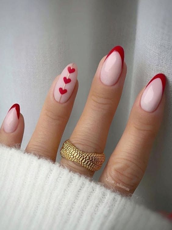 Romantic Heart Motif Nail Design in Soft Pink and Vibrant Red.