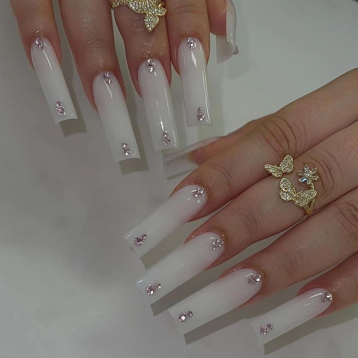 Chic Ombre Nail Design with Rhinestones and Delicate Rings for Sophisticated Elegance.