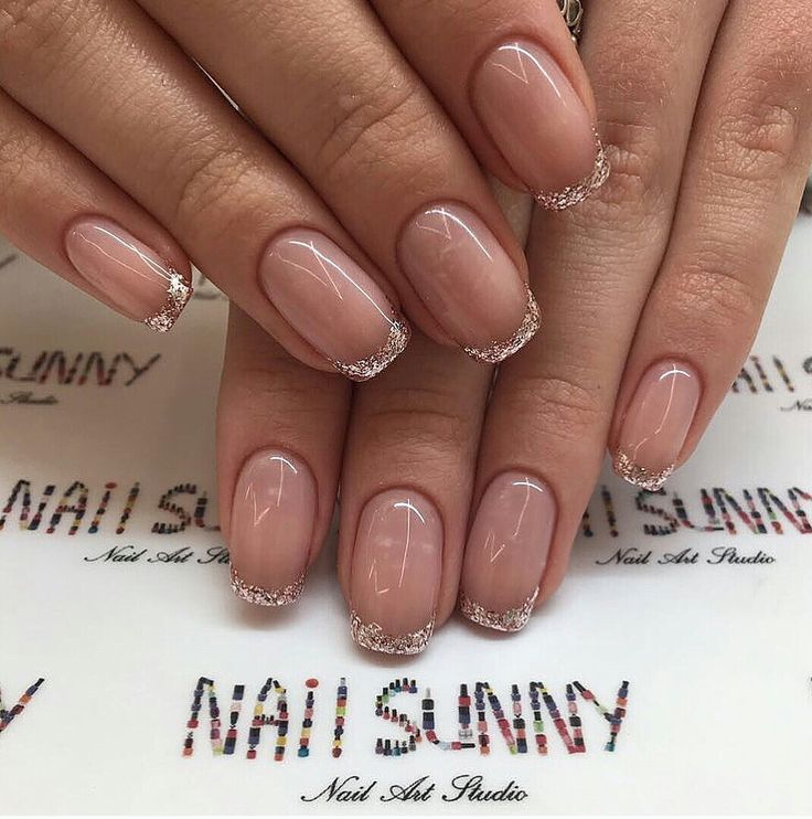 Sophisticated French Manicure with Nude Base and Silver Glitter Tips for Any Occasion.