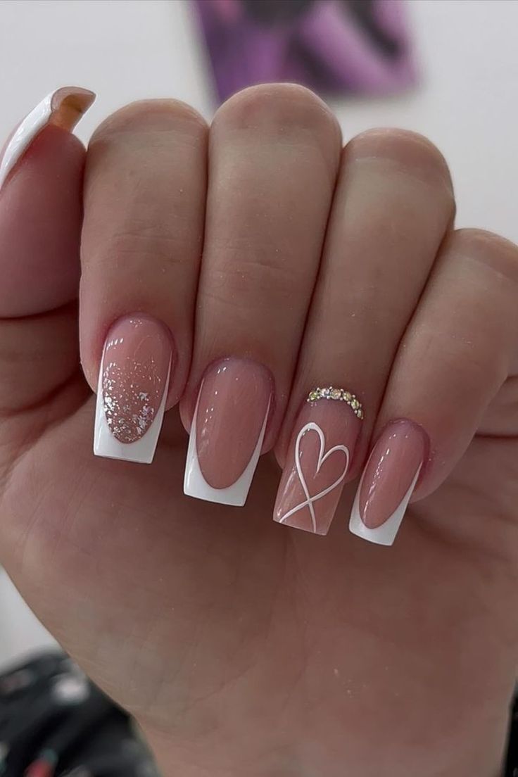 Elegant Chic Nail Design with Soft Pink Base, White Tips, and Playful Accents