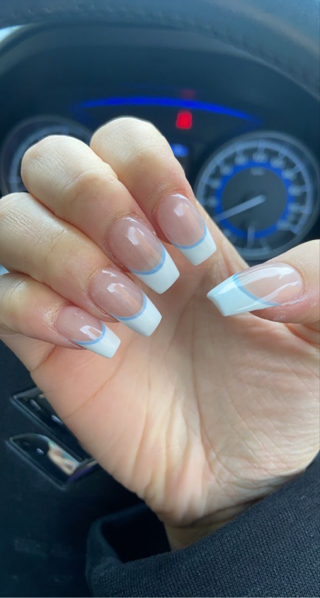 Chic French Tip Nail Design with Soft Blue Accents.