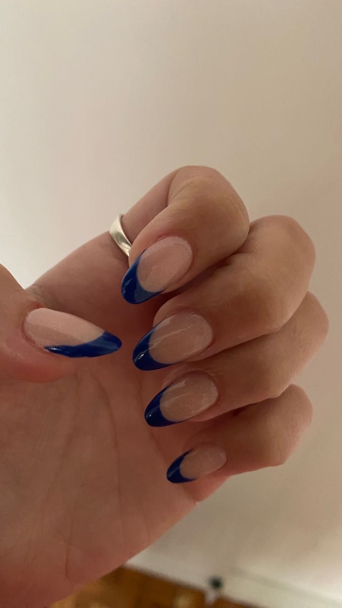 Chic Almond-Shaped Nails: Subtle Nude Base with Striking Blue Tips