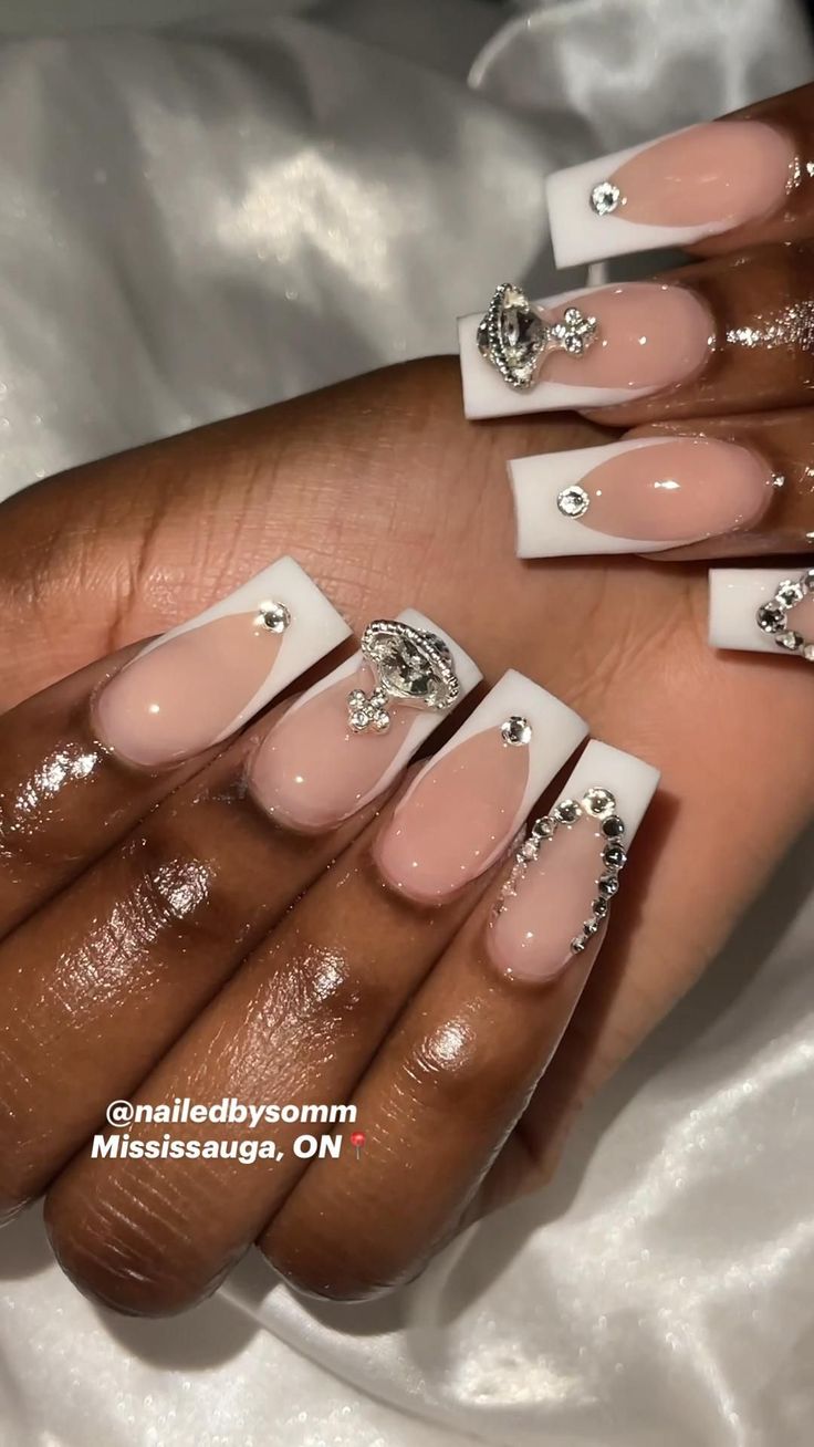 Sophisticated Nude and White Nail Design with Rhinestones for Glamorous Occasions