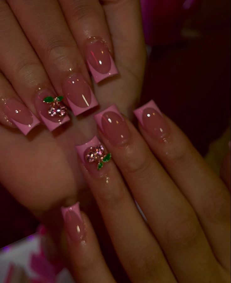 Elegant Playful Nail Design: Soft Pink, Clear Finish, and Floral Embellishments.