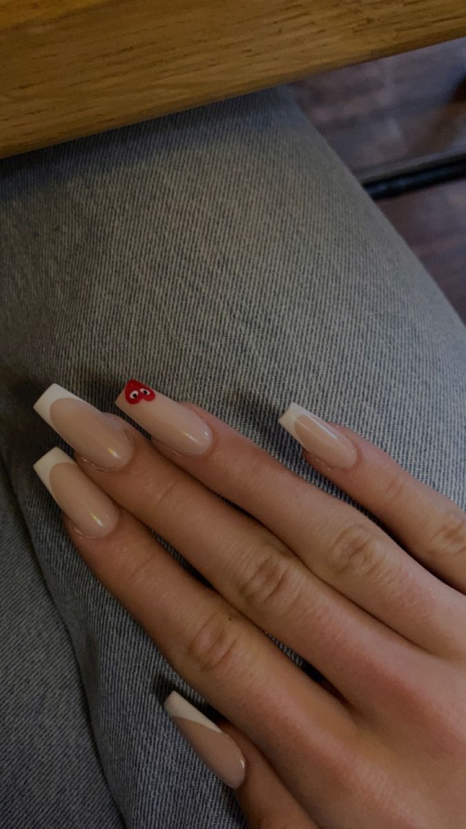 Chic French Tip Manicure with Bold Red Accent for a Trendy Twist.