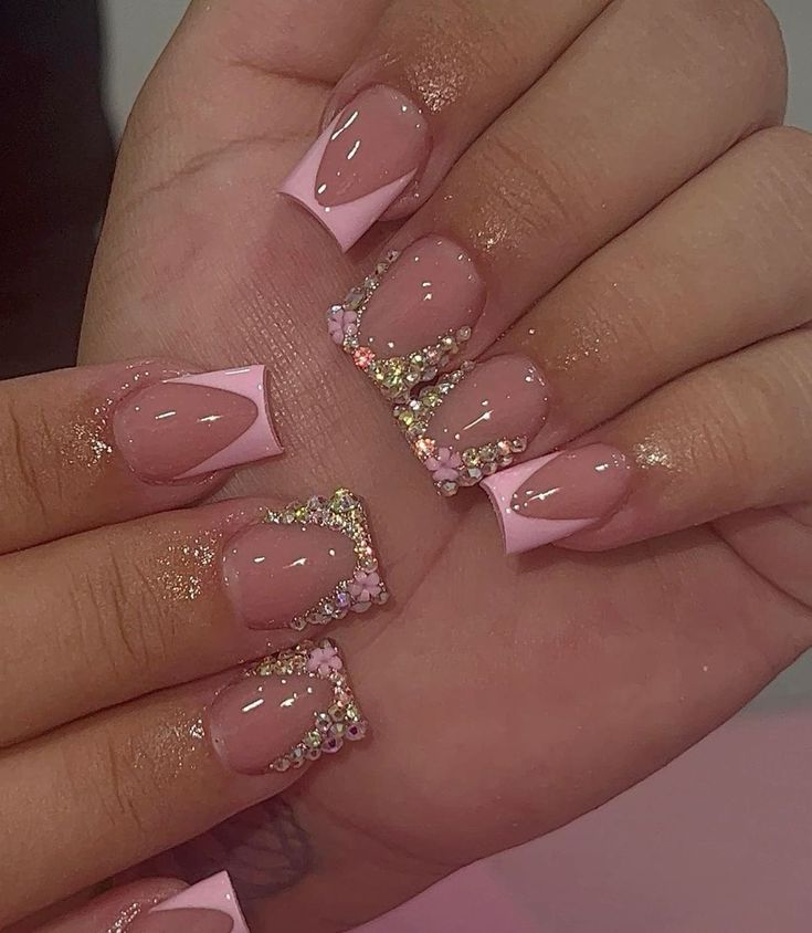 Glamorous Elegant Nail Design: Glossy Nude Base with Soft Pink Accents and Floral Embellishments.