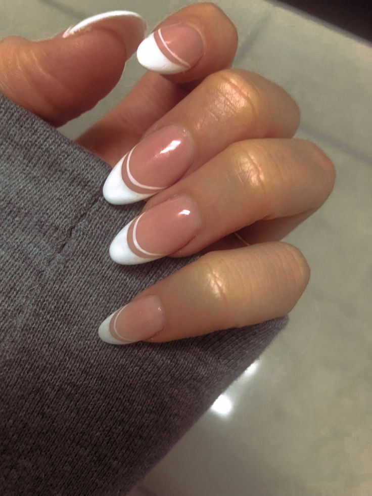 Modern French Manicure: Elegant Glossy Nude Base with Sophisticated Curved White Tips.