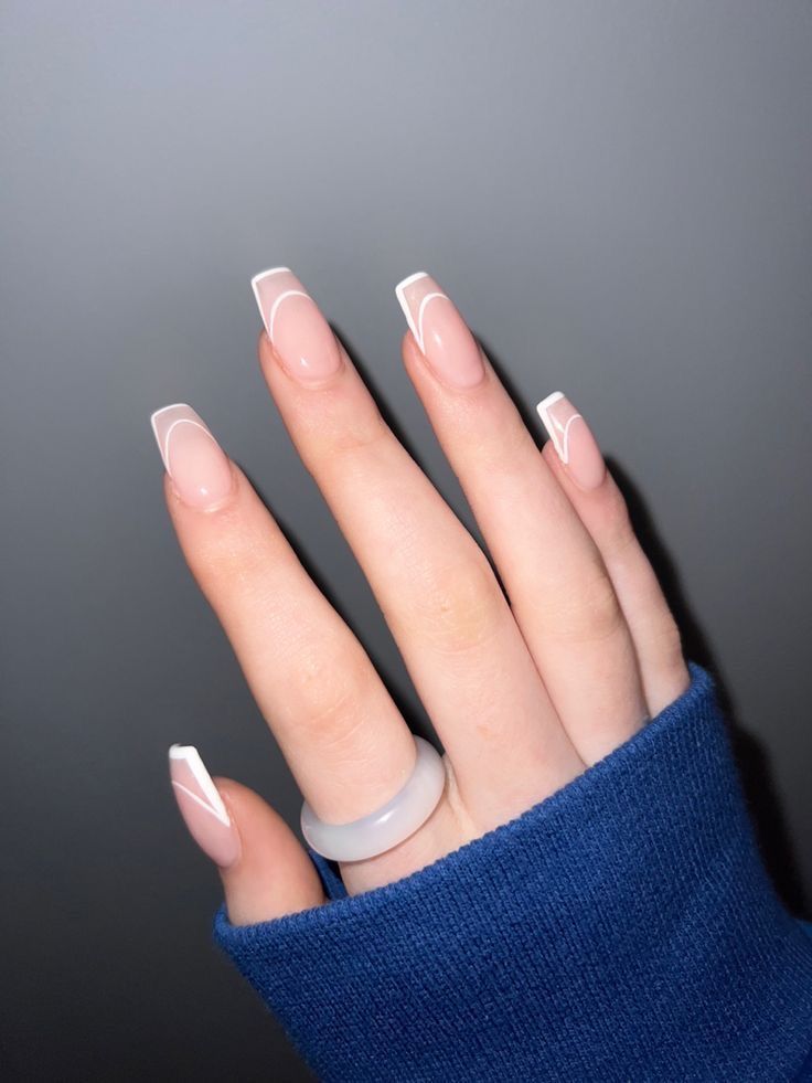 Chic Elegant Nail Design: Glossy Nude Tips with Subtle White Accents for Any Occasion.