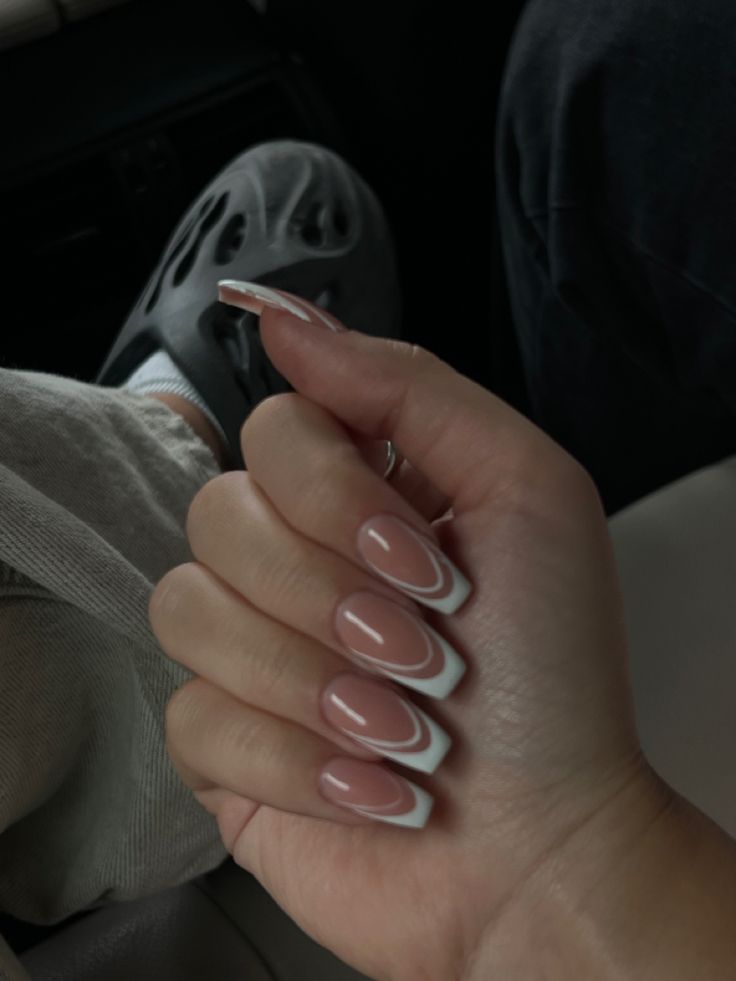 Chic Modern Manicure: Soft Nude Base with Bold White Tips