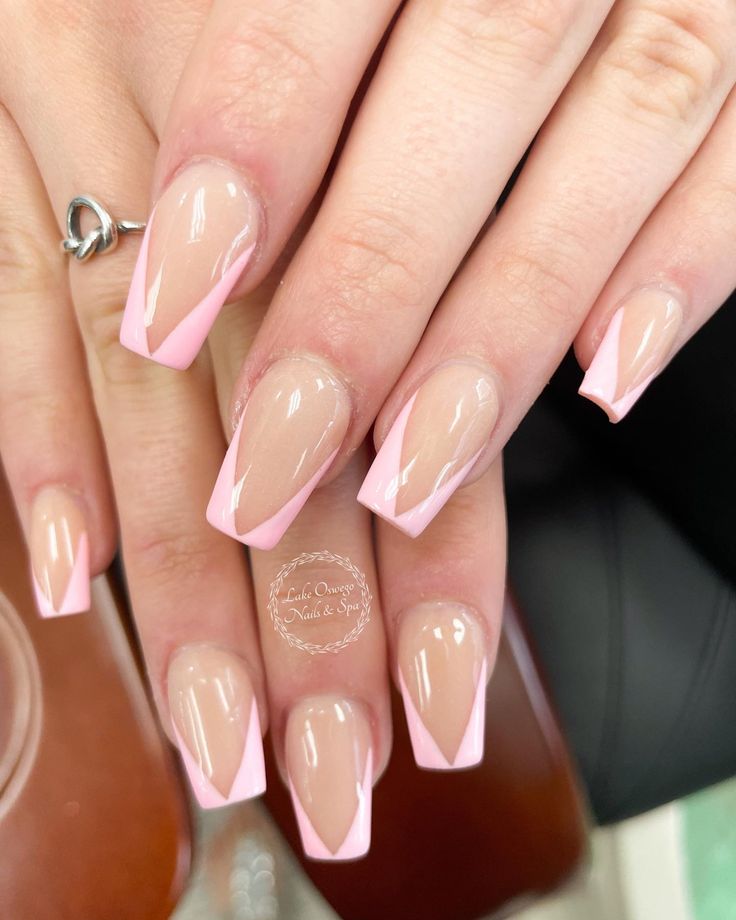 Chic Triangular Accent Nail Design in Nude and Soft Pink Hues.