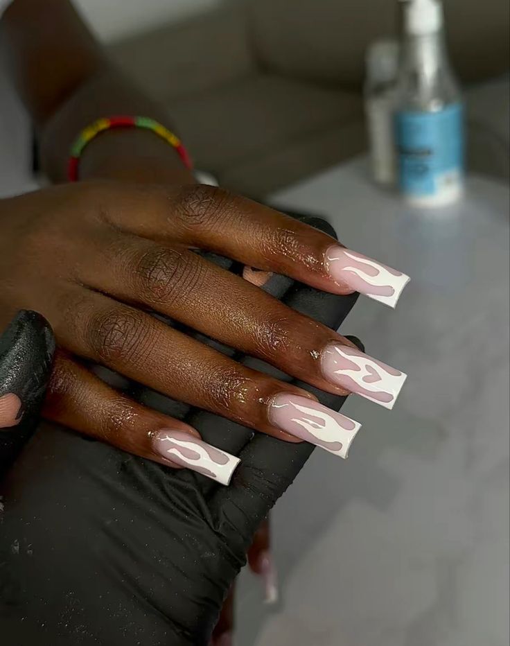 Chic Nail Design: Bold Flame Patterns with Glossy White Tips and Soft Pink Flames