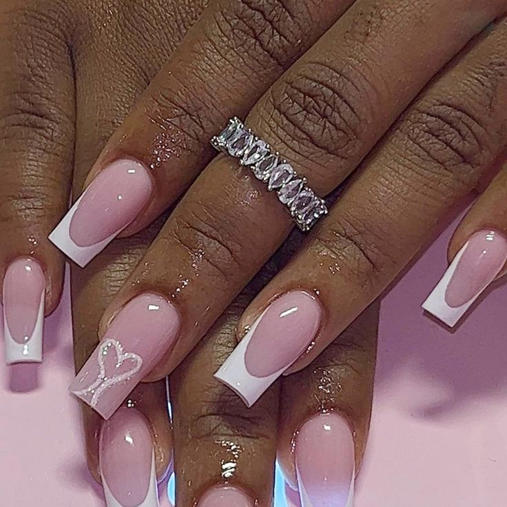 Chic Pink Ombre French Tip Nails with Whimsical Heart and Glossy Finish.