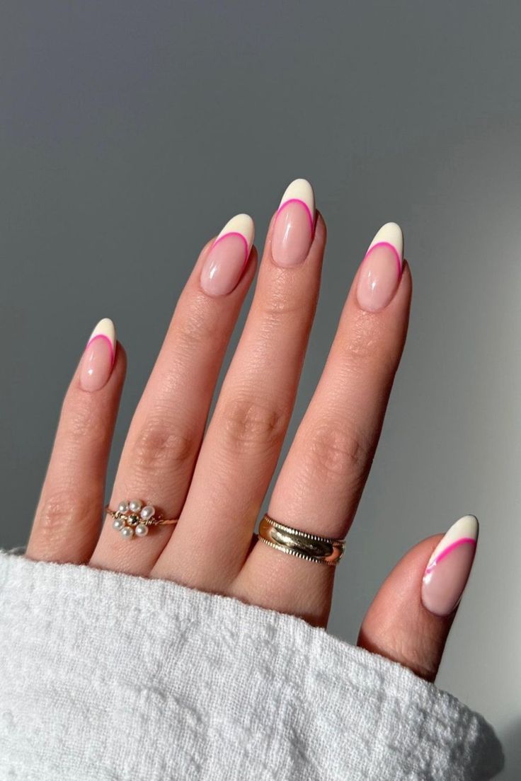 Playful Modern Twist on Classic French Manicure with Vibrant Pink Accents.