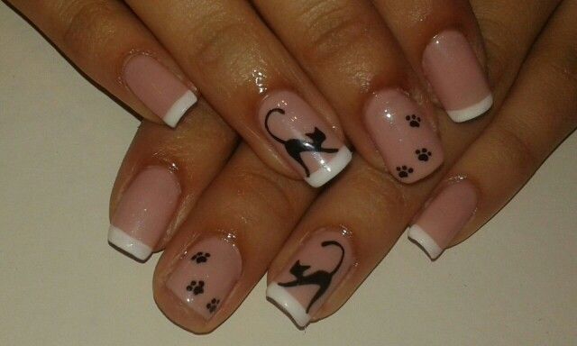 Charming Cat-Themed Nail Design with Pink Base and Playful Silhouettes.