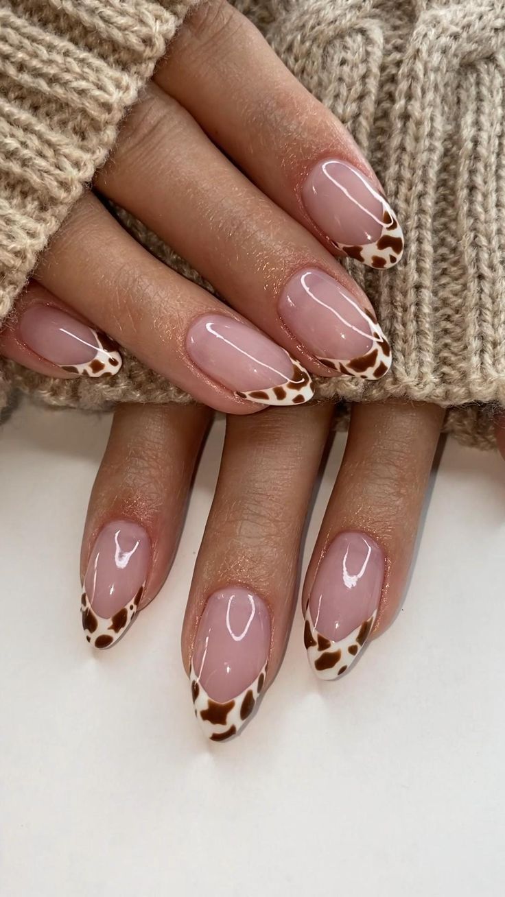 Chic Almond-Shaped Nail Design with Trendy Animal Print Accents.