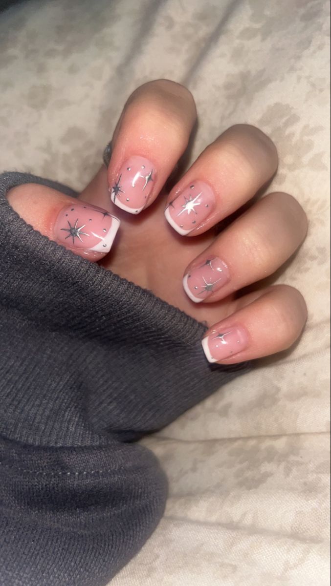 Chic Soft Pink Nail Design with Classic White Tips and Sparkling Silver Stars