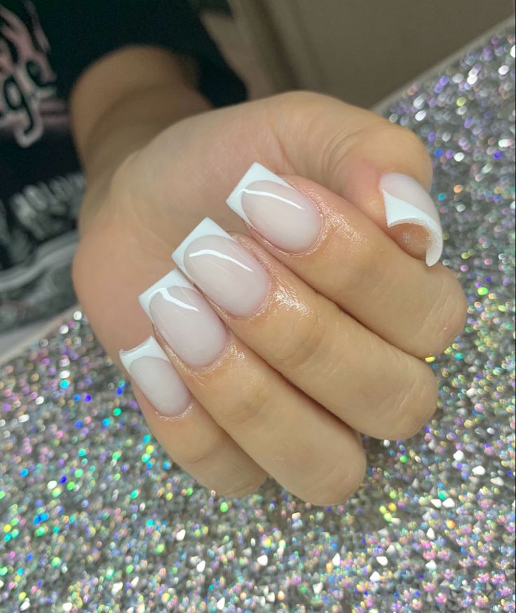 Sophisticated French Manicure with Soft Nude Base and Crisp White Tips.