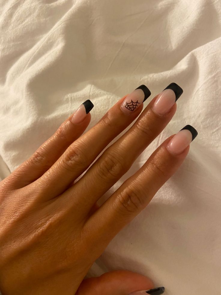 Chic and Playful Elegant Nail Design with Nude Base and Bold Black Tips