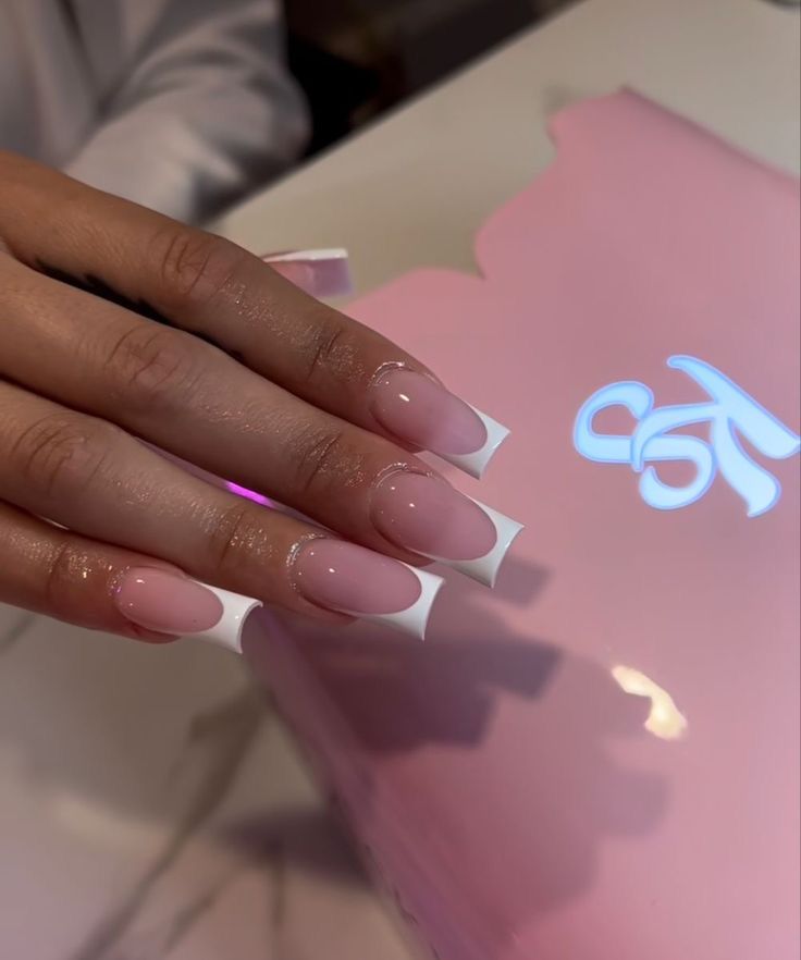 Sophisticated Elegant Nail Design: Soft Pink and White Tips with Glossy Finish.