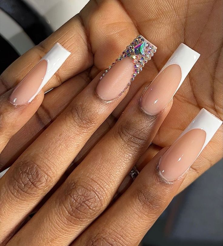 Chic French Manicure: Glossy Nude Base with White Tips and Sparkling Rhinestone Accent.