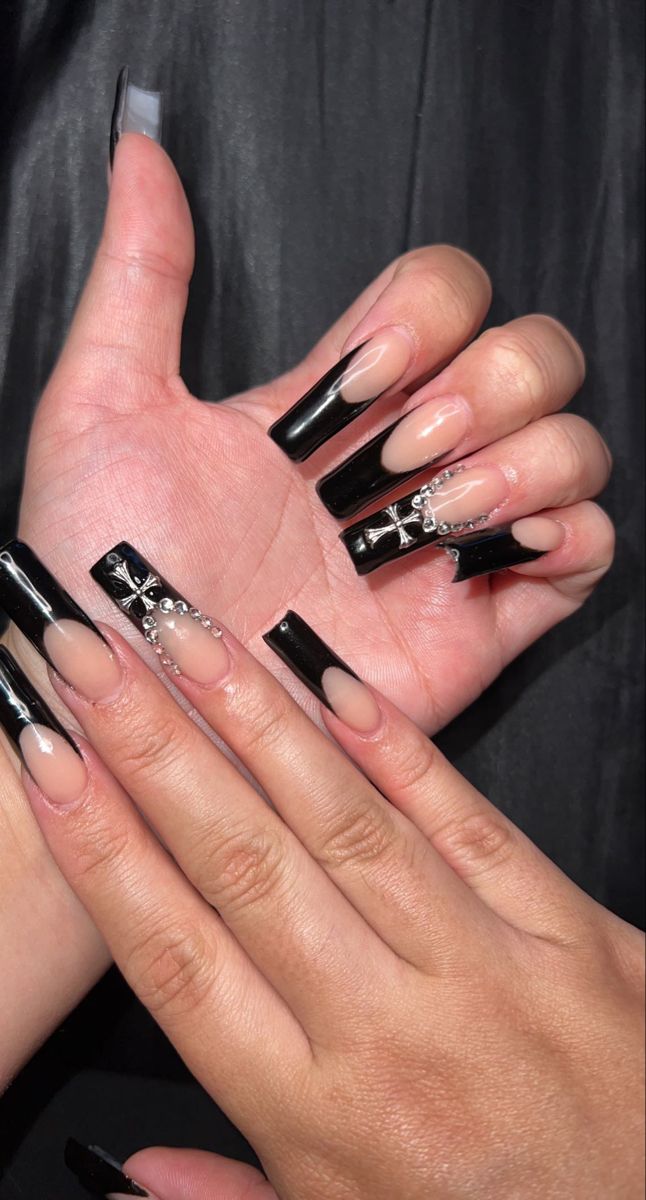 Sophisticated Nail Design: Glossy Black Tips and Nude Bases Adorned with Rhinestones and Patterns