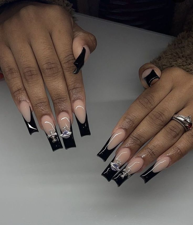 Elegant Black and Nude Acrylic Nails with Sleek Tips and Silver Accents