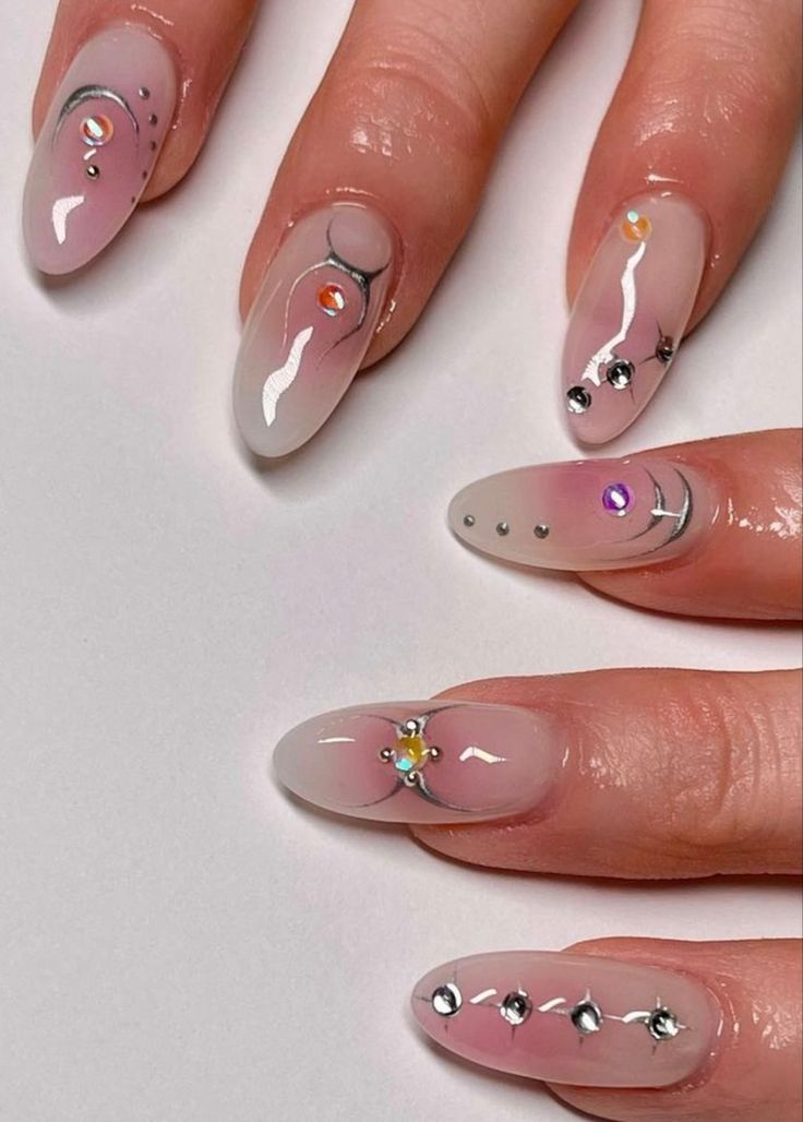 Chic Ombre Nail Design with Metallic Accents and Minimalist Flair