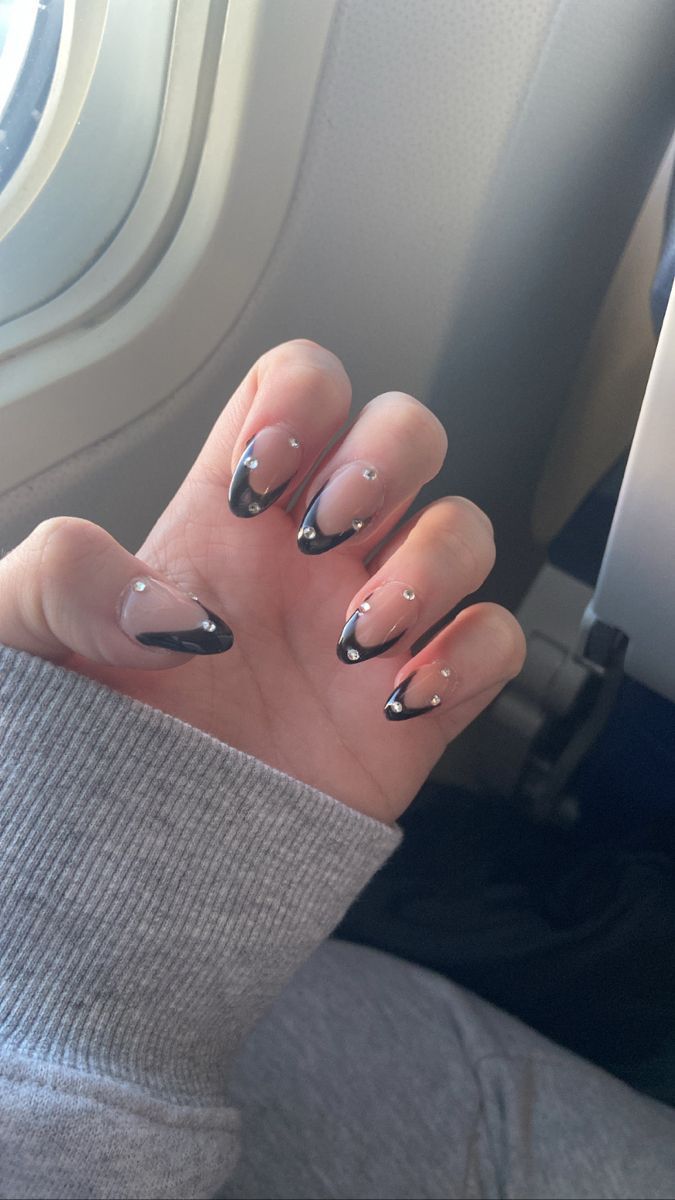 Chic Black-Tipped French Manicure with Rhinestone Accents: A Modern Elegant Twist.