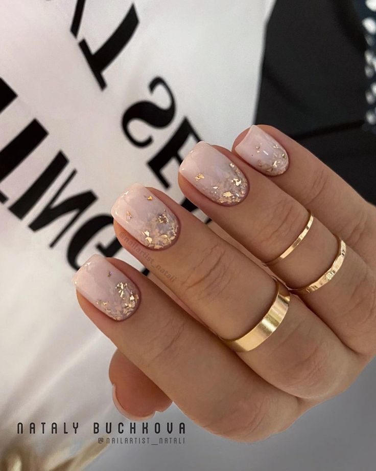 Elegant Nude Nail Design with Gold Leaf Accents for a Glamorous Look