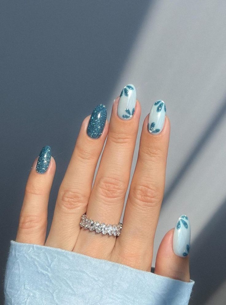 Elegant Teal and Blue Nail Design with Sparkling Glitter Accents.