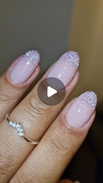 Sophisticated Soft Pink Nail Design with Glitter Tips and Seamless Gradient