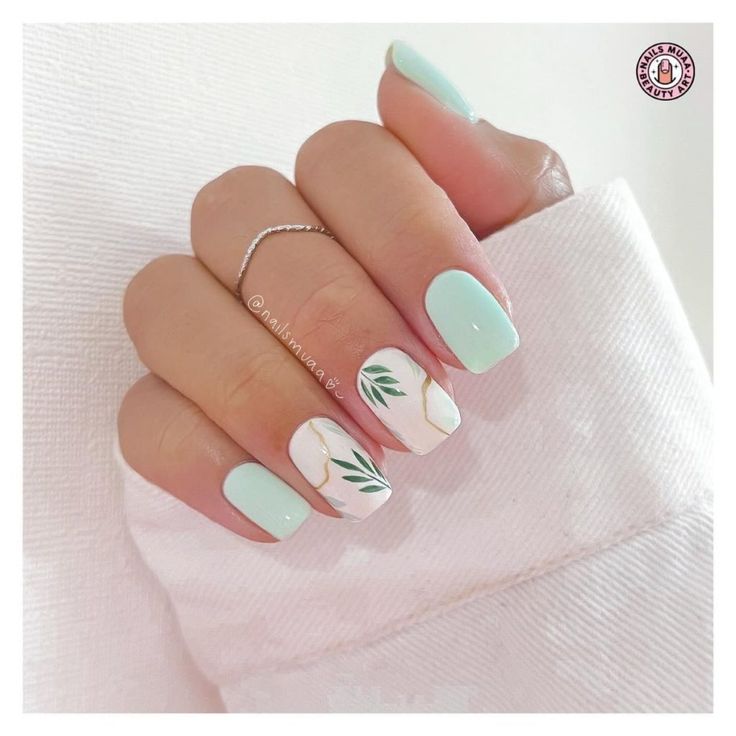 Chic Pastel Mint Nail Design with Botanical Accents for Year-Round Elegance.