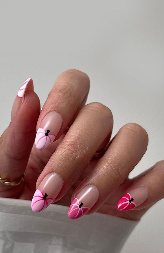 Whimsical Pink and Nude Nail Art with Delicate Floral Accents