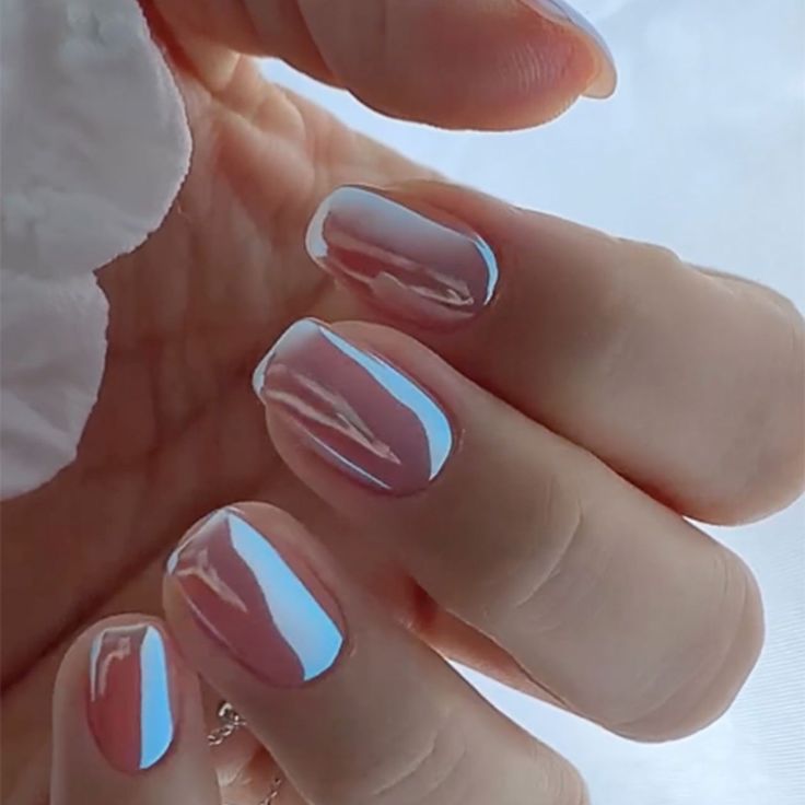 Sophisticated Soft Pink Nails with Striking Blue Accent