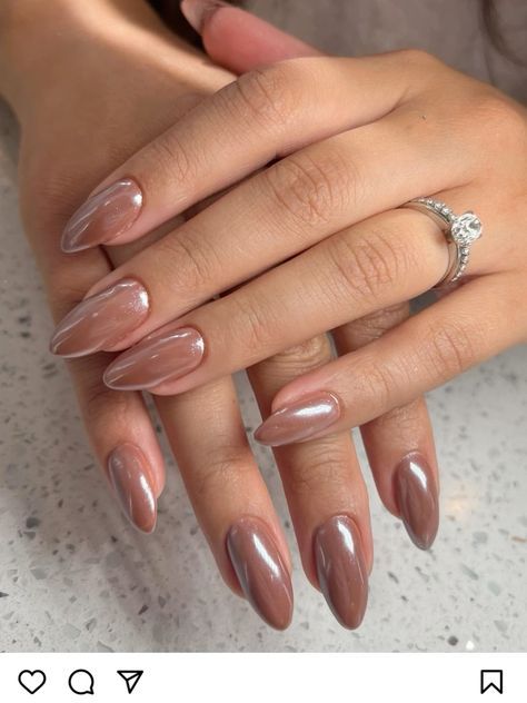 Elegant Almond-Shaped Nails with Glossy Nude-Brown Polish: A Versatile Style for Any Occasion.