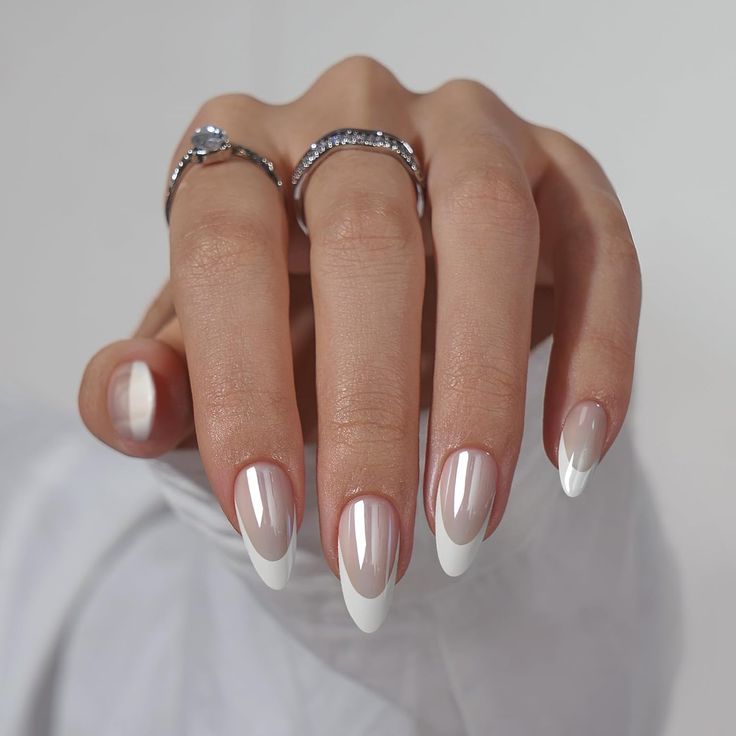 Chic Almond-Shaped Nude and White Nail Design with Glossy-Matte Contrast.