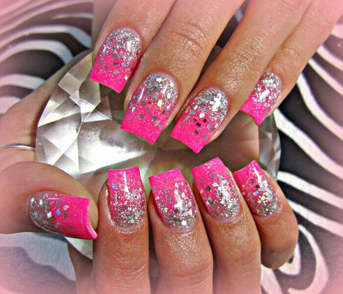 Chic and Playful Nail Design: Bright Pink Tips with Shimmery Silver Glitter Base