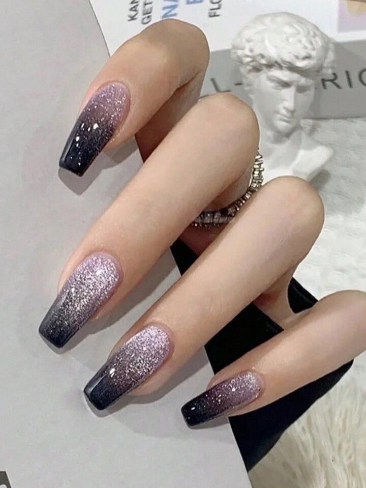 Elegant Ombre Nail Design: Soft Lavender to Deep Black with Glitter Accents.